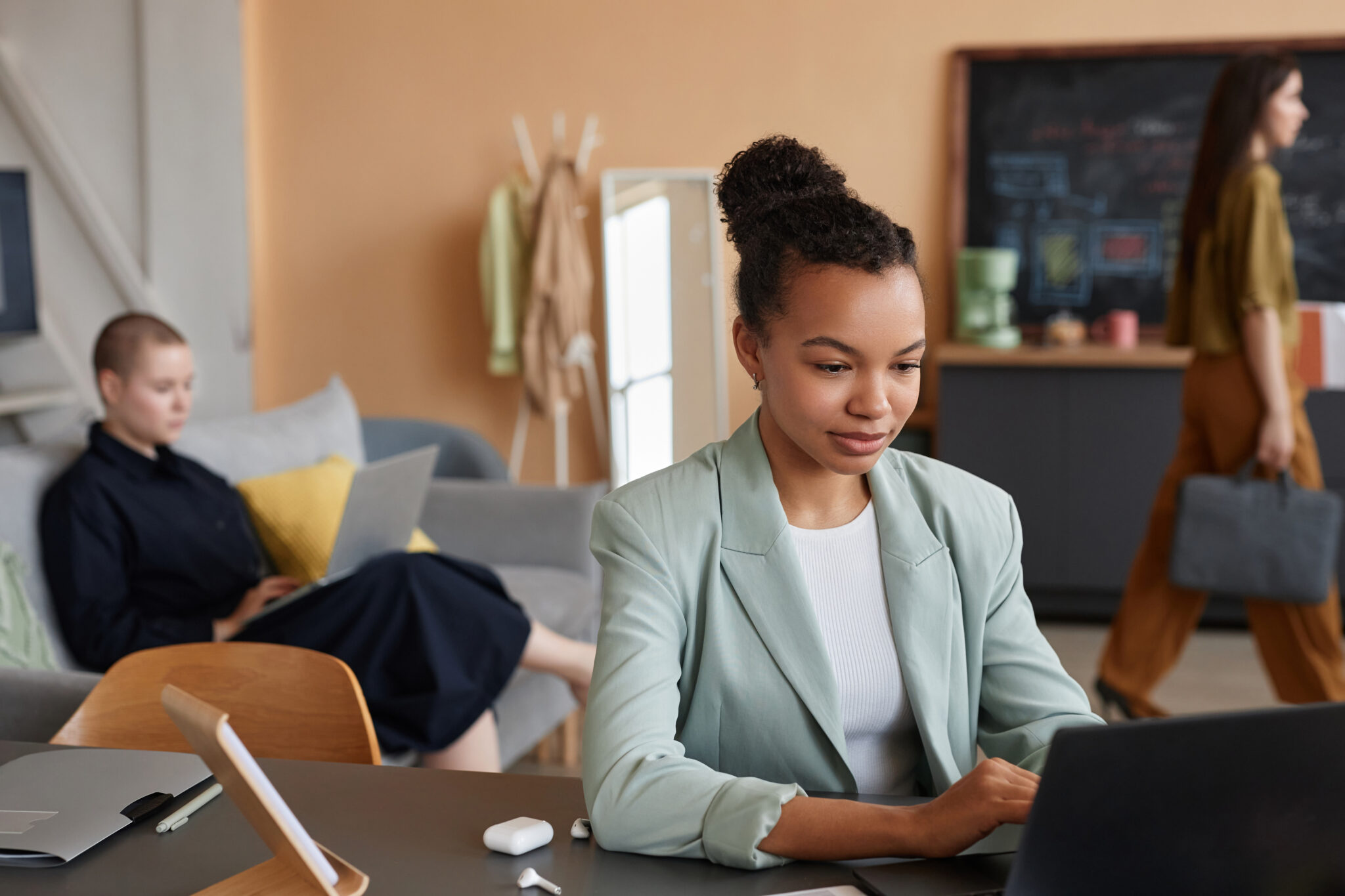 A campus IT security administrator reviewing IoT device vulnerabilities and risks on a laptop, using Cylera’s platform for precise risk remediation and enhanced cybersecurity measures.