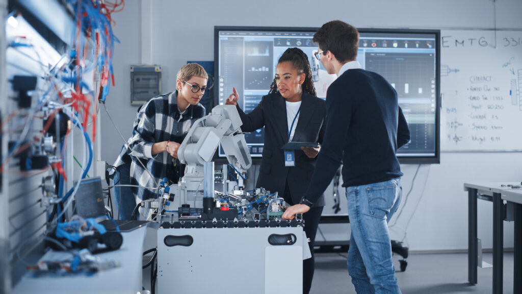 University students in a robotics lab working with IoT-connected devices, securely monitored and protected on the campus network using Cylera’s cybersecurity platform.