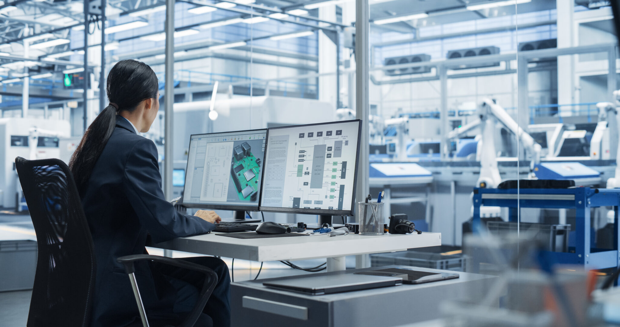 A manufacturing engineer monitoring IoT-connected devices and production assets in real-time using Cylera’s platform, ensuring security, operational efficiency, and high-fidelity asset intelligence in an automated factory environment.