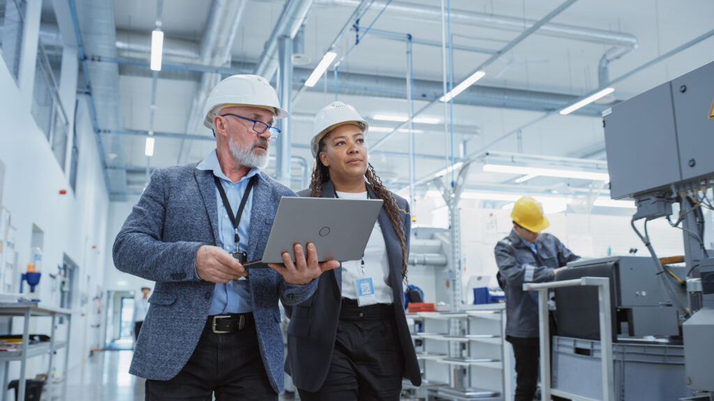 A manufacturing IT team using Cylera’s platform on a factory floor to monitor IoT security, track regulatory compliance, and ensure operational integrity.