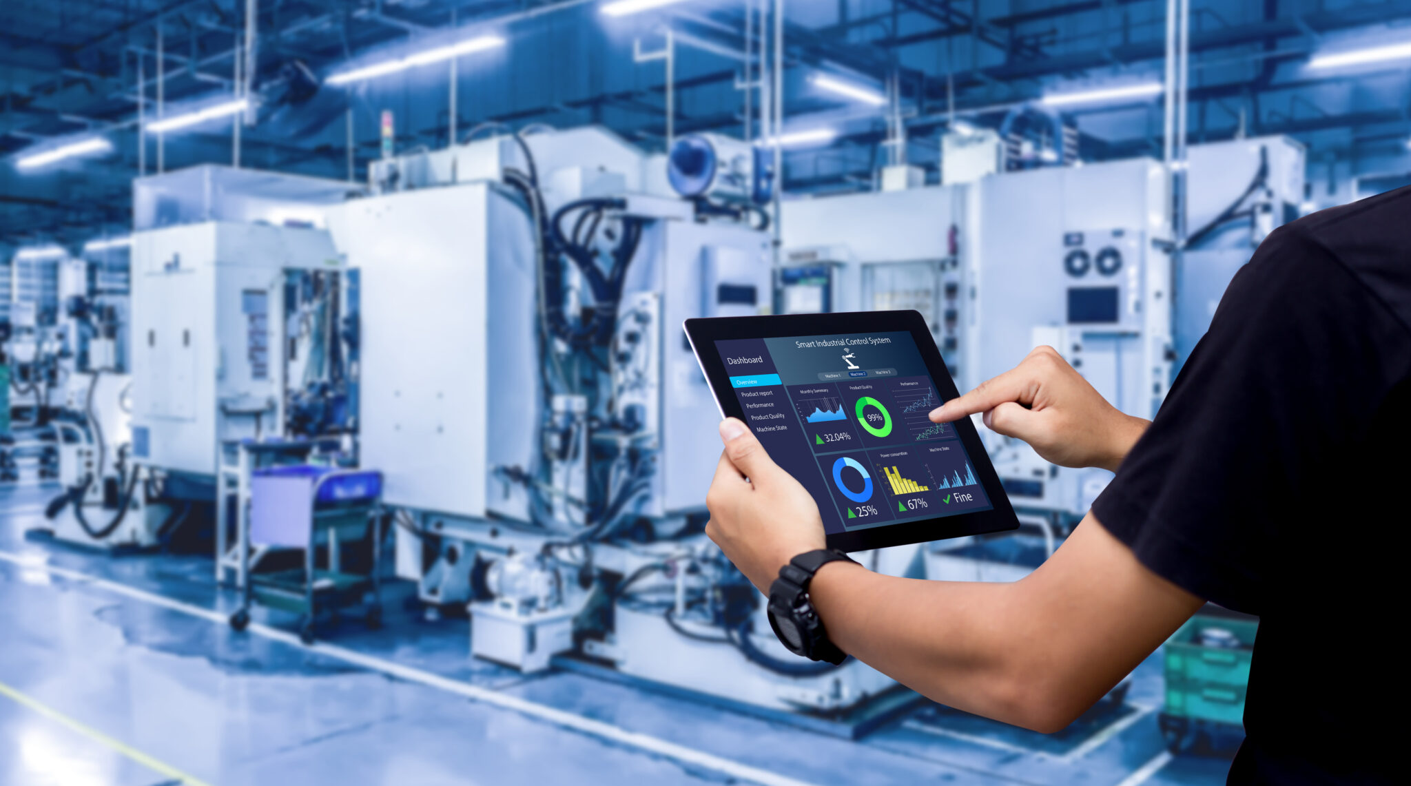 A manufacturing IT analyst using Cylera’s platform on a tablet to monitor IoT device security analytics and operational metrics in a smart factory environment.