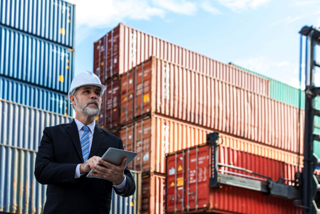 A transportation and logistics industry CIO using a tablet to view IoT device inventory and security data for IoT sensors used to track shipping containers and reduce the risk of lost or stolen cargo.