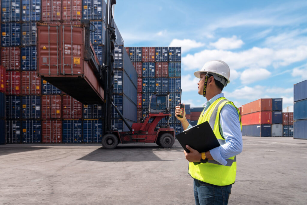 A transportation and logistics industry employee tracking shipping containers using a handheld IoT device to track data transmitted by IoT sensors inside of containers that the Cylera platform can assess for IoT device vulnerabilities and risks