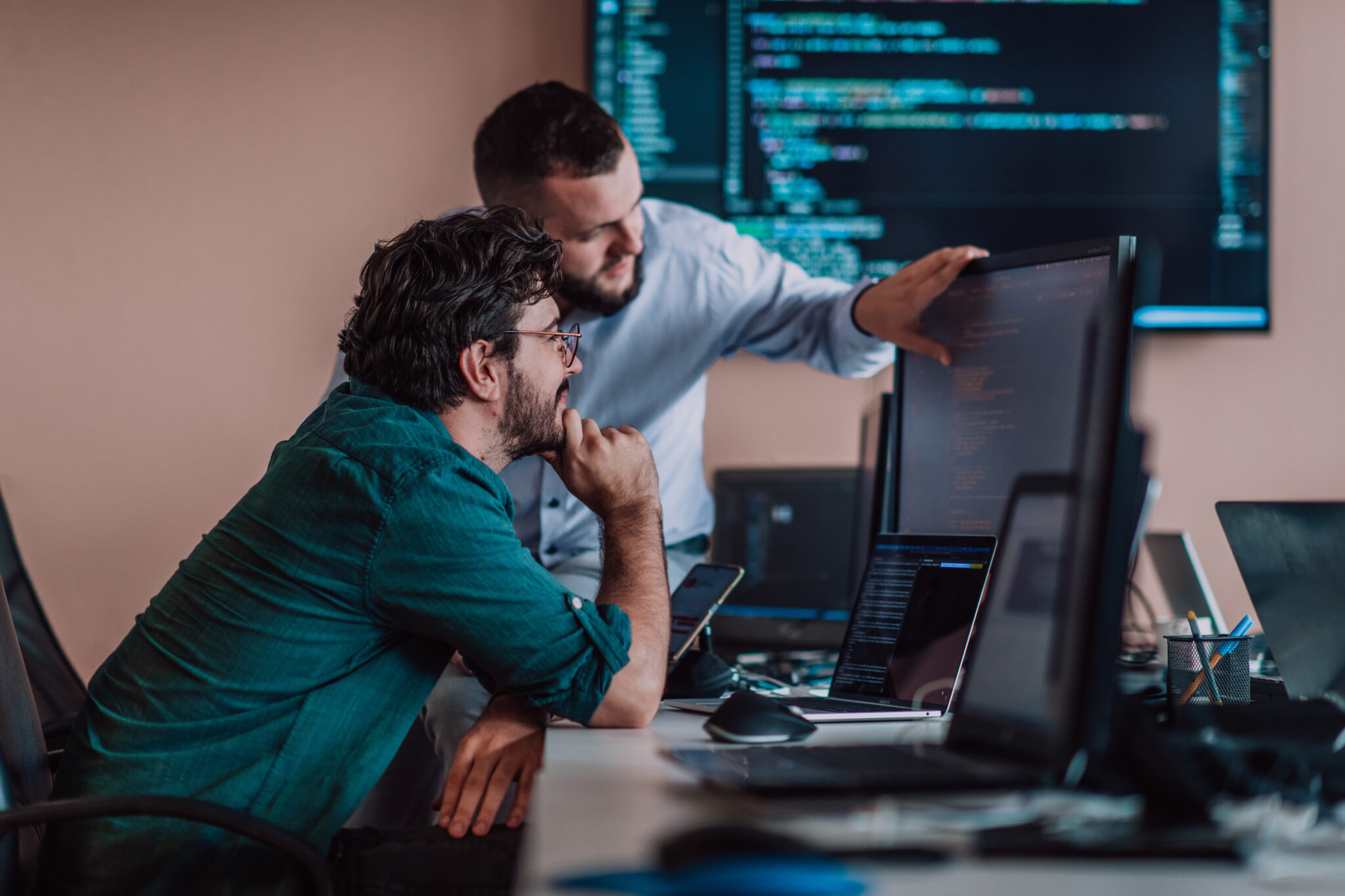 A transportation and logistics industry IT security team reviewing IoT threat remediation guidance provided by the Cylera platform to speed IoT device cyber threat containment and incident response on a computer monitor.